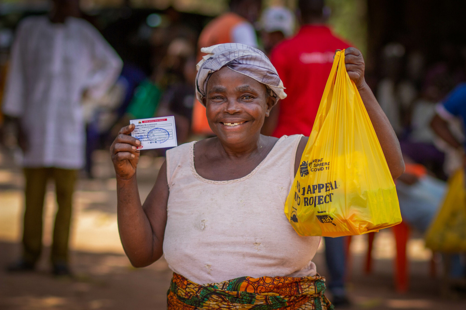 Woman with hygiene kit funded by Christian Aid in Adagi, Nigeria